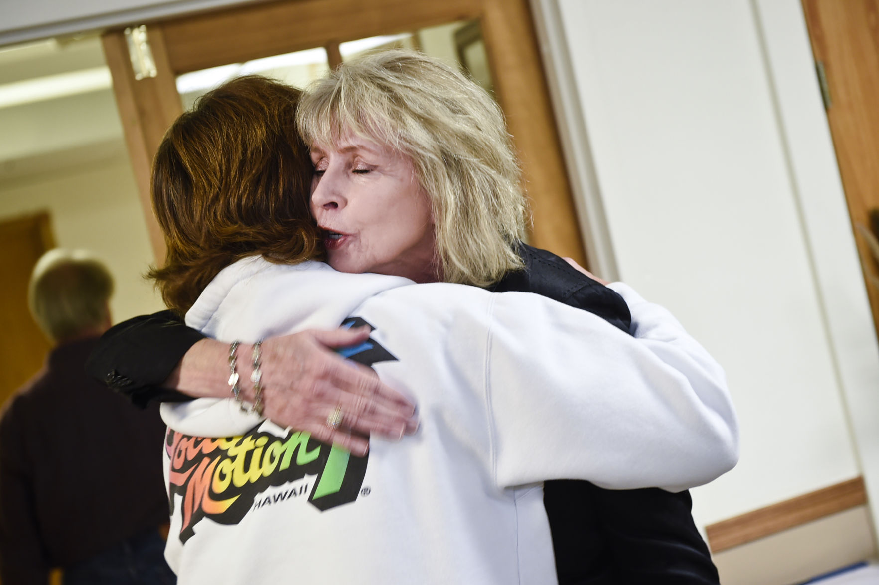Medley receives a congratulatory hug Monday morning.